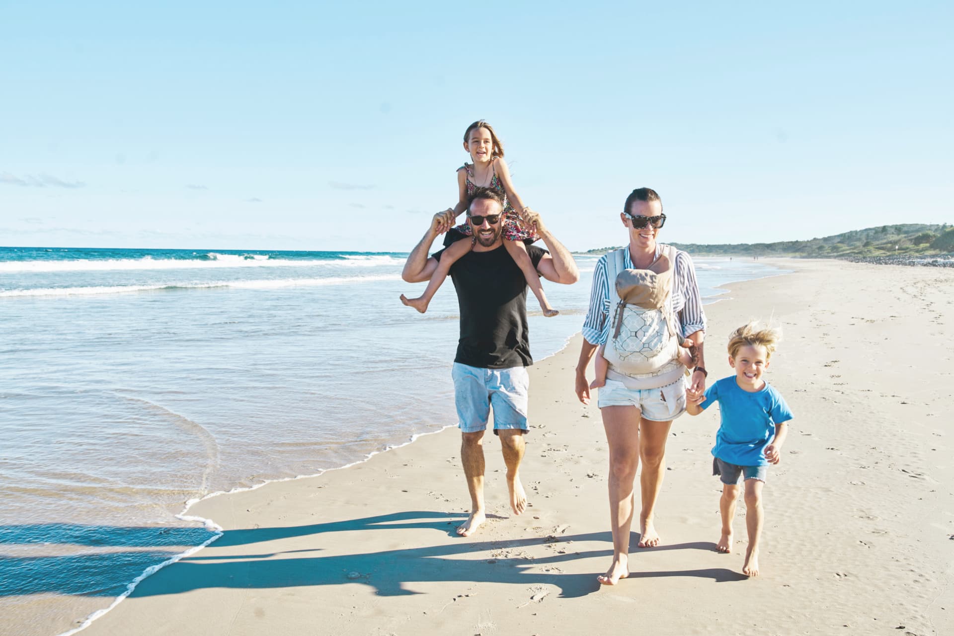 Family walking together on an Australian beach